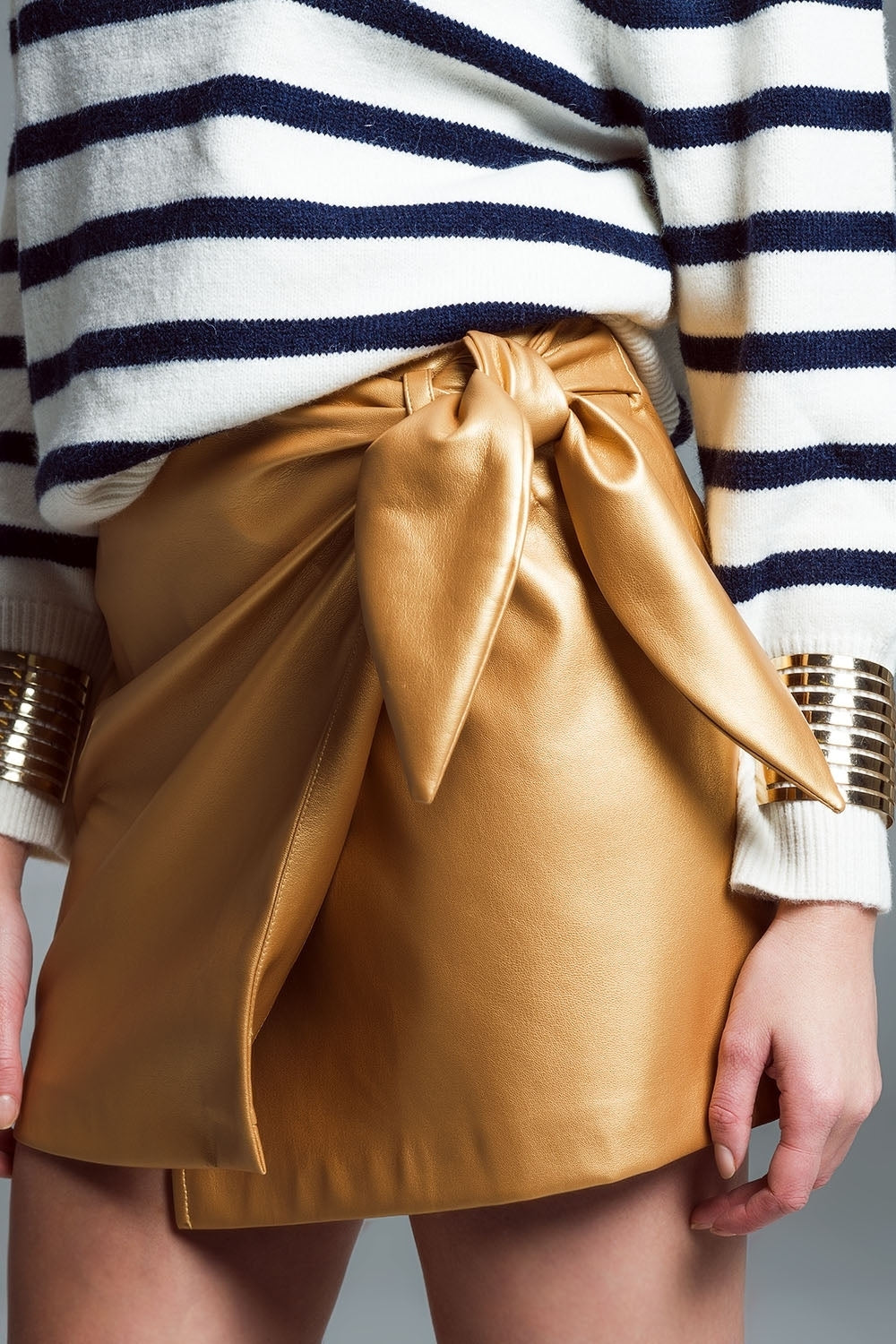 Leather Mini Skirt With Bow On The Side In Gold
